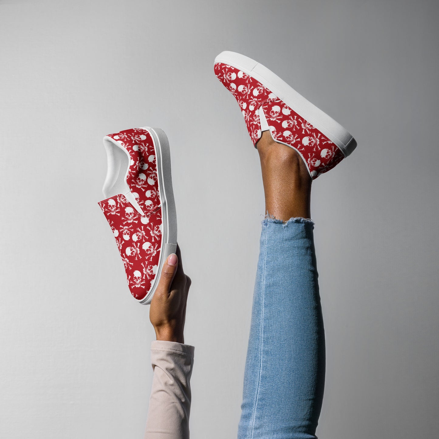 Skulls on red Women’s slip-on canvas shoes